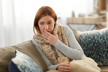 Image showing sick woman in scarf coughing at home