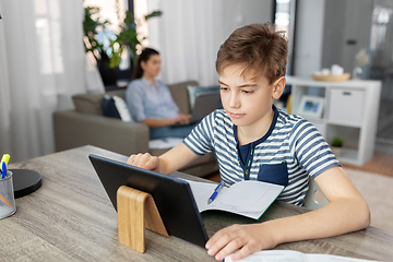 Image showing student boy with tablet computer learning at home