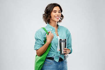 Image showing woman with bag for food shopping and tumbler