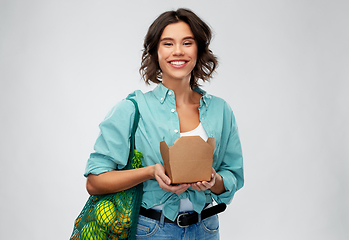 Image showing happy woman with food in reusable net bag and wok