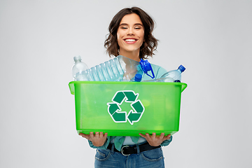 Image showing smiling young woman sorting plastic waste