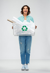 Image showing happy smiling young woman sorting paper waste