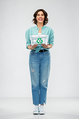 Image showing smiling young woman sorting metallic waste