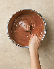 Image showing process of making dough for chocolate cake