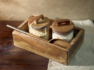 Image showing product storage jars in a wooden box