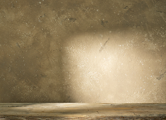 Image showing beige wall and wooden shelf