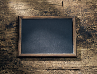 Image showing blackboard frame on wooden table