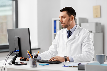 Image showing male doctor with computer working at hospital