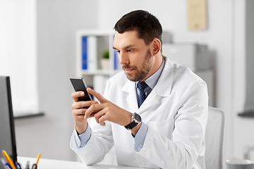 Image showing male doctor with smartphone at hospital