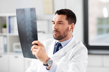 Image showing male doctor with x-ray of spine at hospital