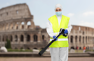 Image showing sanitation worker in hazmat with pressure washer