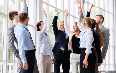 Image showing business people celebrating success at office