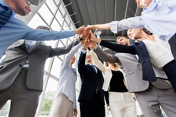 Image showing business people making high five at office