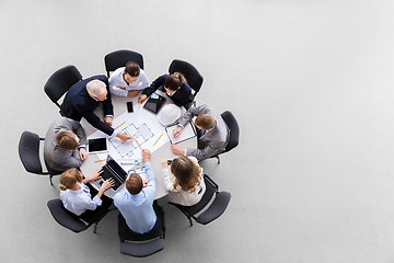 Image showing architects with laptop and blueprint at office