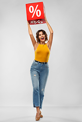 Image showing happy smiling young woman with sale sign