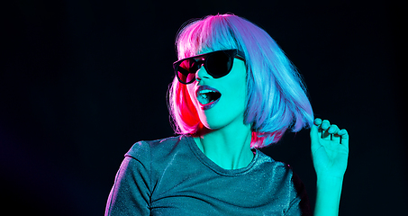 Image showing happy woman in pink wig and black sunglasses