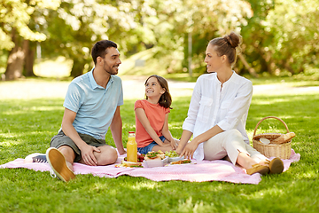 Image showing happy family having picnic at summer park