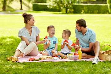 Image showing happy family having picnic at summer park