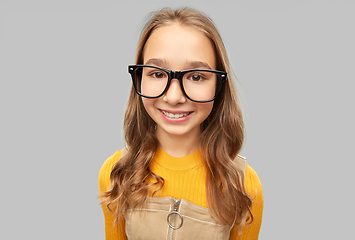 Image showing smiling teenage student girl in glasses