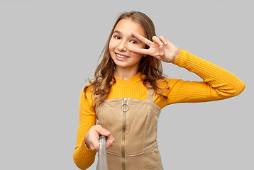 Image showing happy teenage girl taking selfie and showing peace