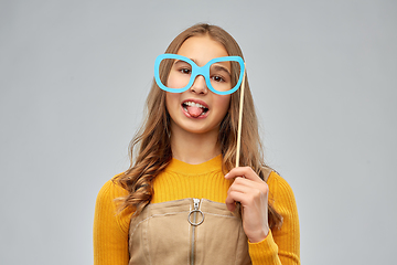 Image showing smiling teenage girl with big glasses