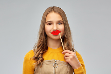 Image showing happy teenage girl with red lips party accessory