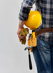 Image showing worker or builder with helmet and working tools