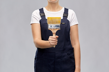 Image showing close up of painter or builder with paint brush