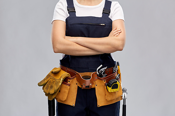 Image showing woman or builder with working tools on belt