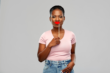 Image showing african american woman with red lips accessory