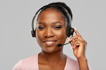 Image showing african american woman in headset with microphone