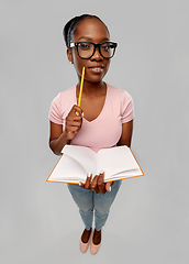 Image showing happy african american woman with notebook