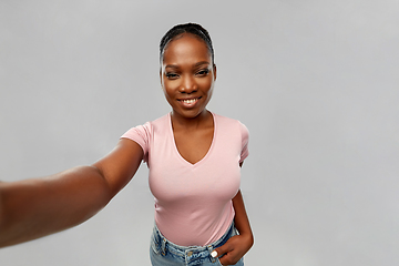 Image showing happy african american woman taking selfie