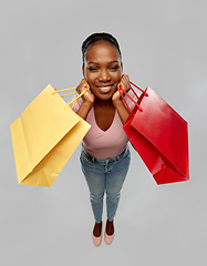 Image showing happy african american woman with shopping bag