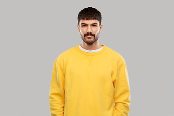 Image showing young man in yellow sweatshirt