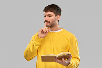 Image showing thinking man with diary and pencil