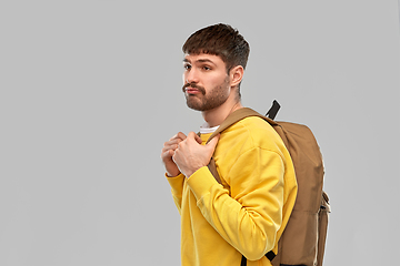 Image showing sad unhappy young man with backpack