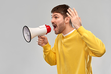Image showing angry man shouting to megaphone
