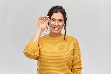 Image showing happy smiling young woman in glasses