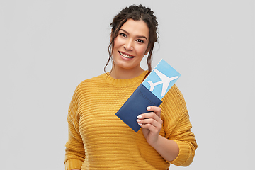 Image showing happy young woman with air ticket and passport