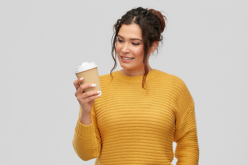 Image showing smiling woman with pierced nose holding coffee cup