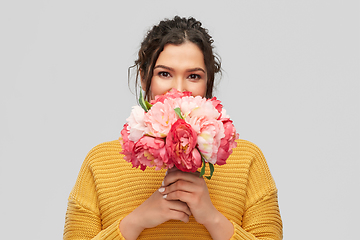 Image showing happy smiling young woman with bunch of flowers