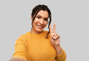 Image showing woman with pierced nose taking selfie shows peace