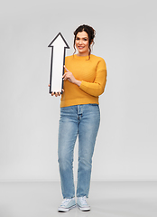 Image showing smiling young woman with big white upward arrow