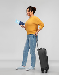 Image showing woman with passport, air ticket and travel bag