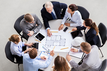 Image showing architects with laptop and blueprint at office