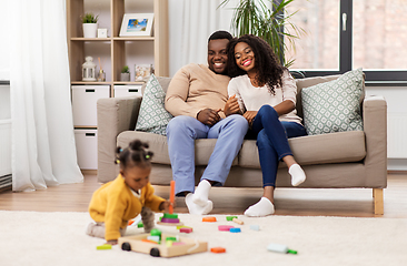 Image showing african family with baby daughter playing at home