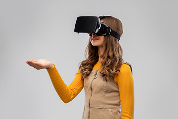 Image showing teenage girl in vr glasses over grey background