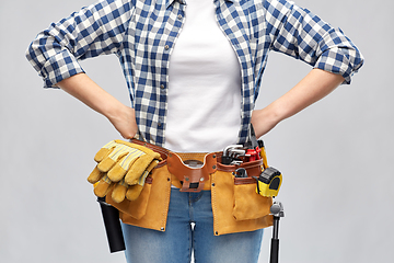 Image showing woman or builder with working tools on belt