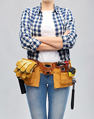 Image showing woman or builder with working tools on belt